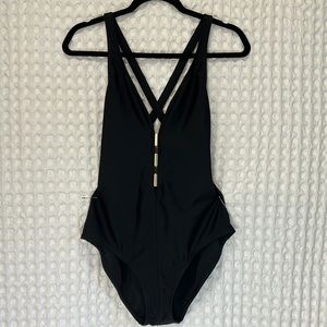 Sexy black one piece with peekaboo v neck & silver embellishments size 14